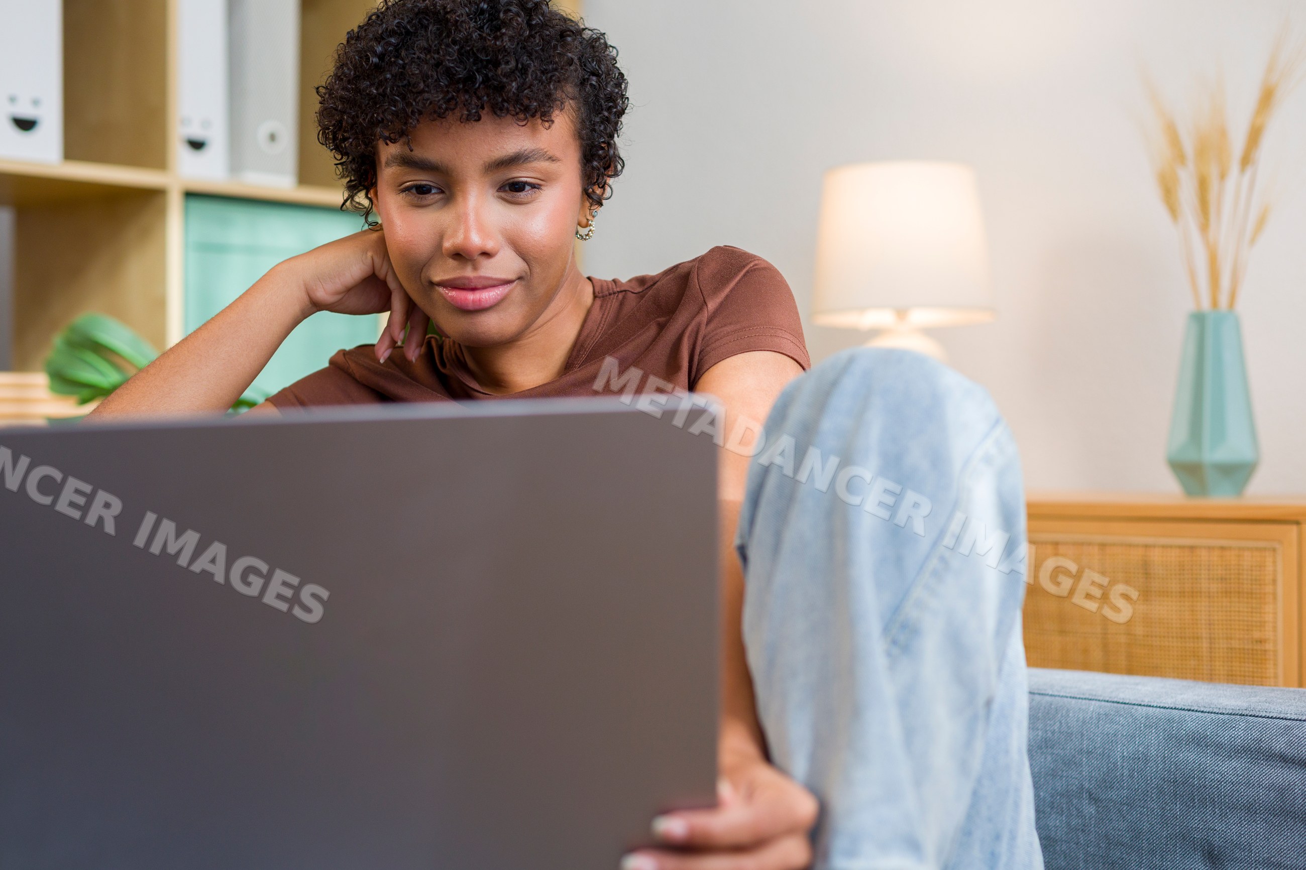 Young African American woman using laptop