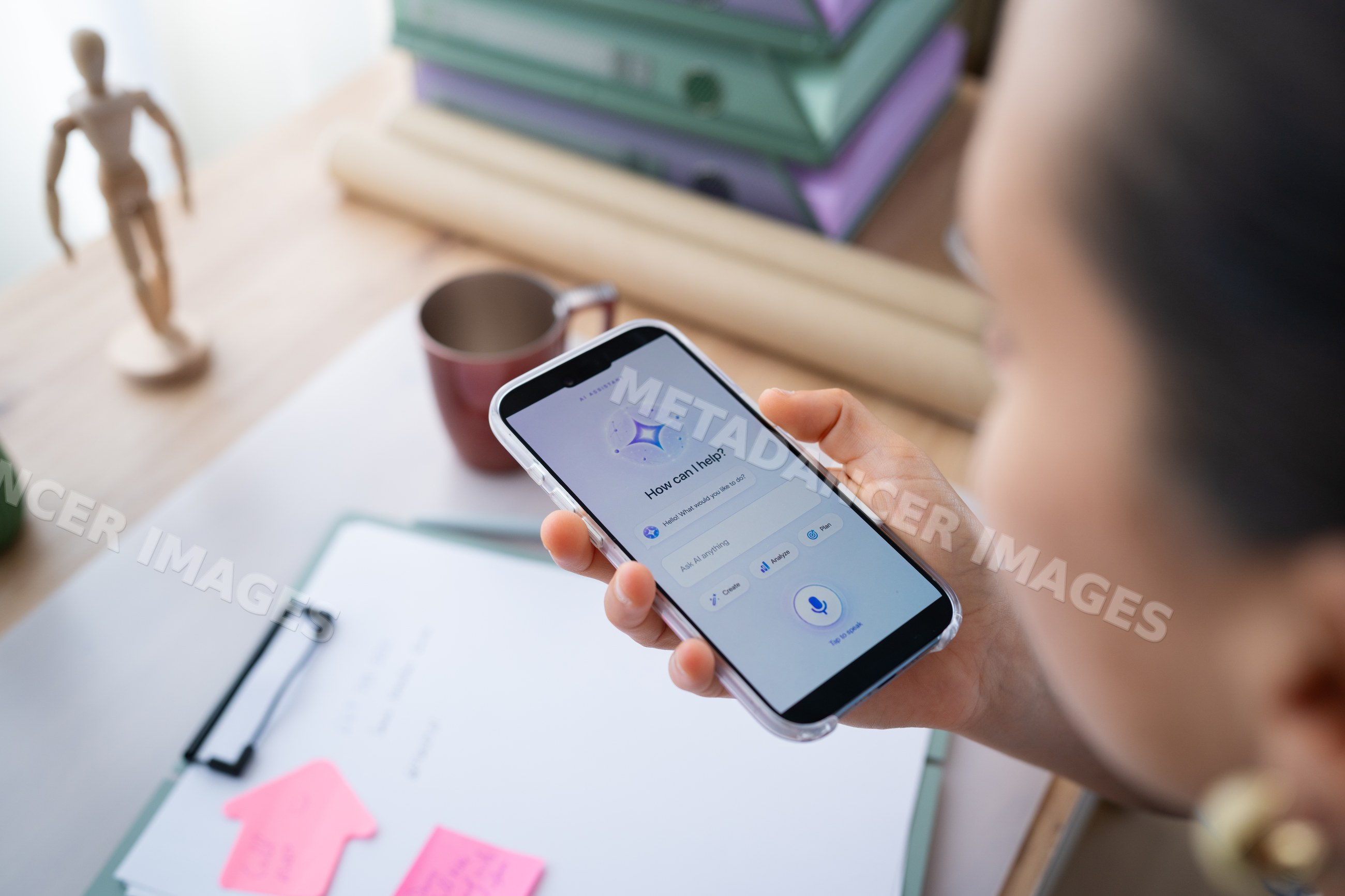 White person holding smartphone with voice assistant app
