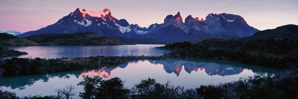 Los cuernos mountains reflecting in lago pehoe at sunset