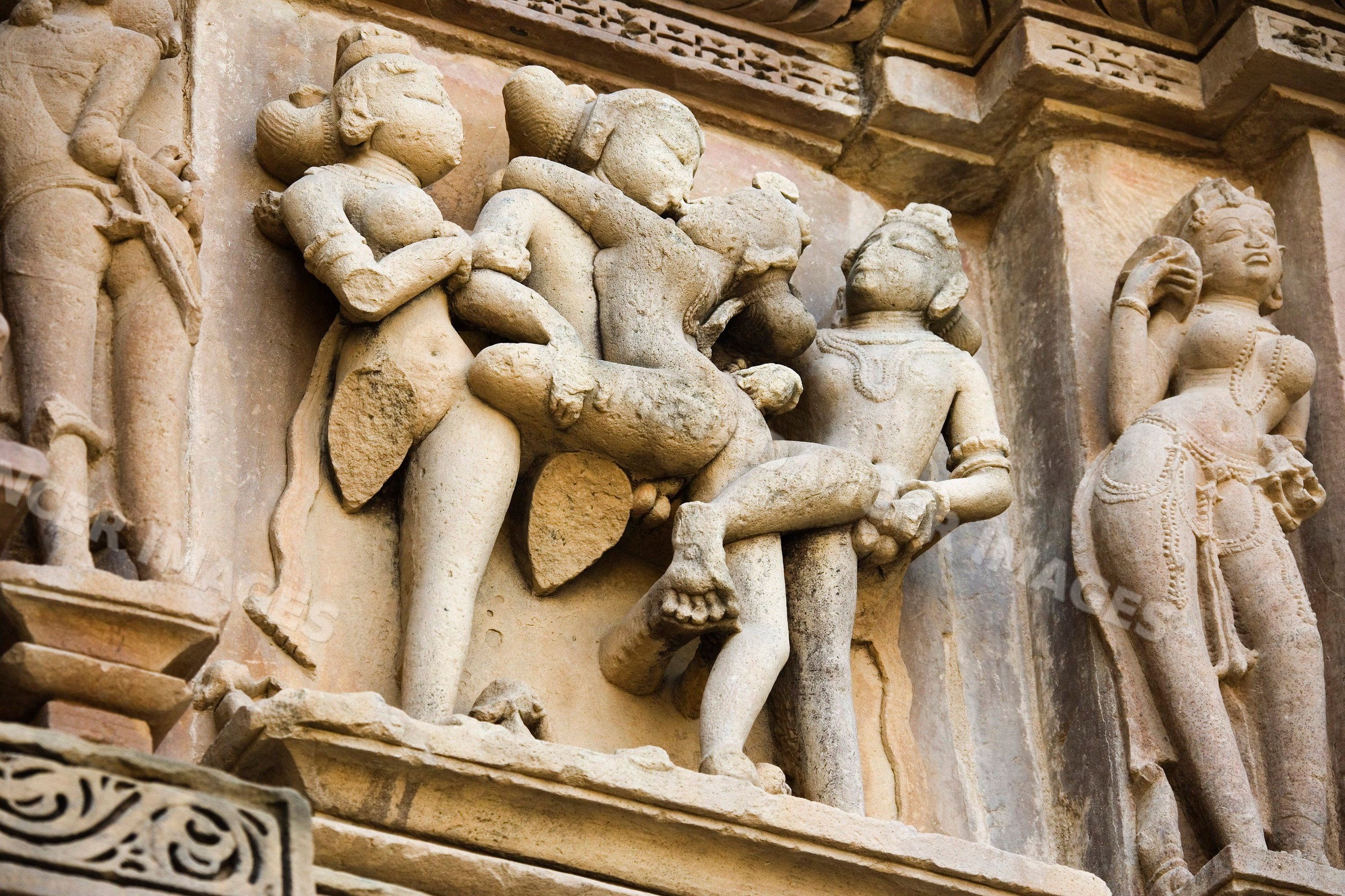 Erotic stone sculptures on khajuraho temple wall india