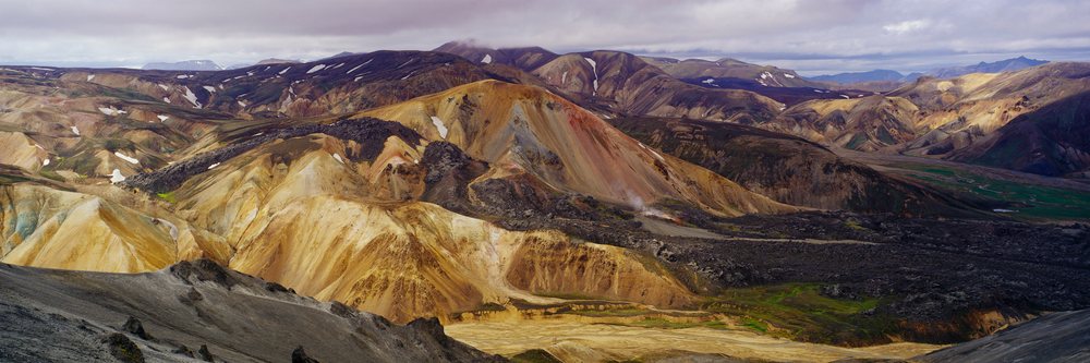 Colorful volcanic mountains panoramic landscape with rugged terrain