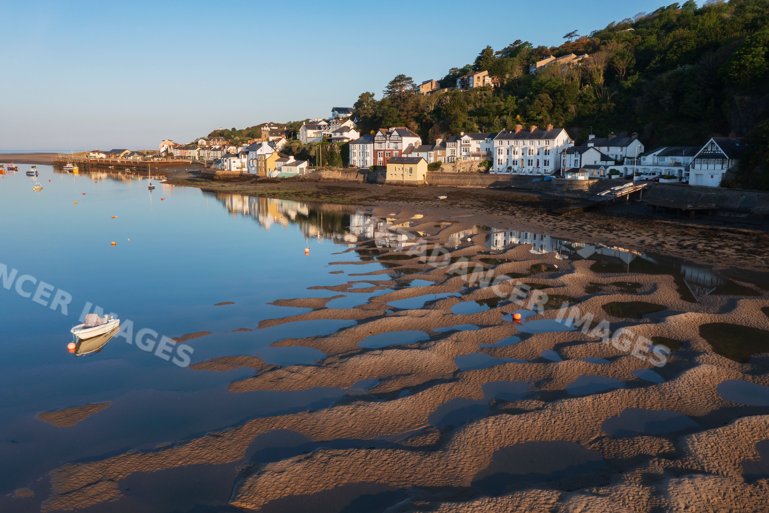 Dyfi estuary sand and mud patterns with boats and coastal houses
