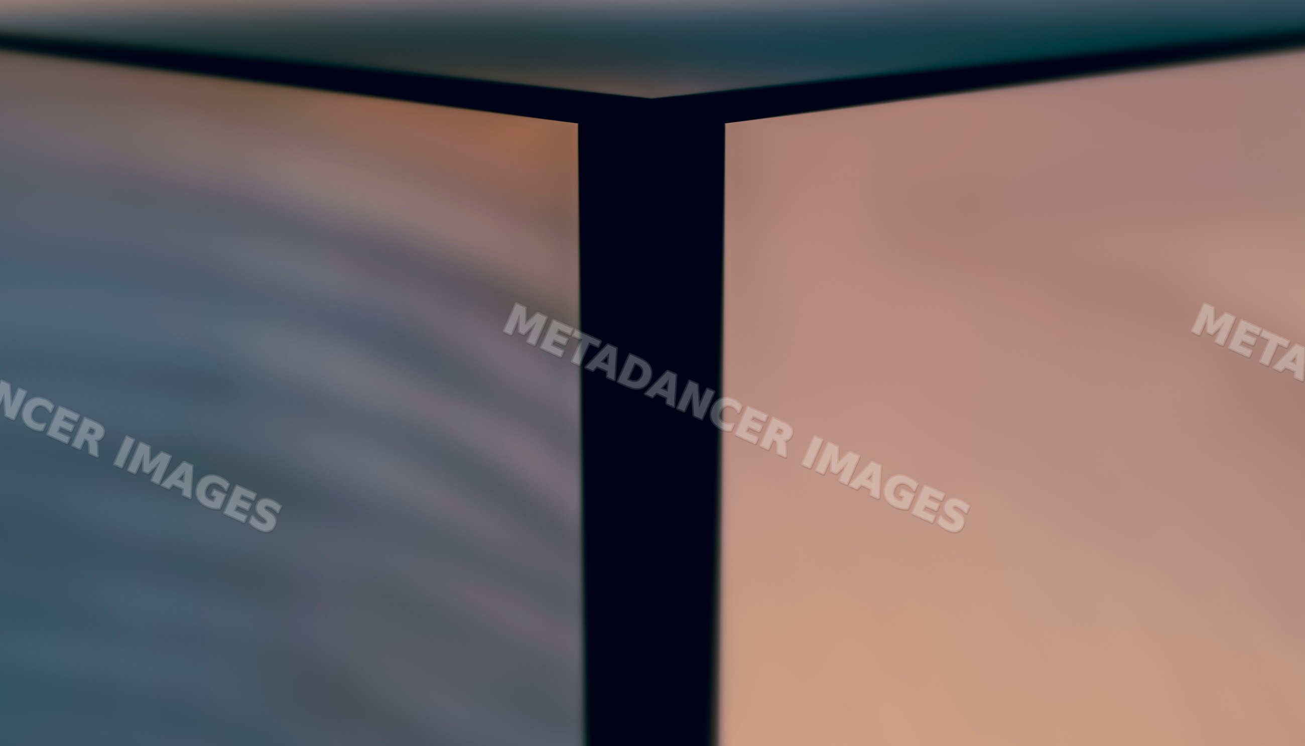 Softly illuminated corner where two modern walls meet