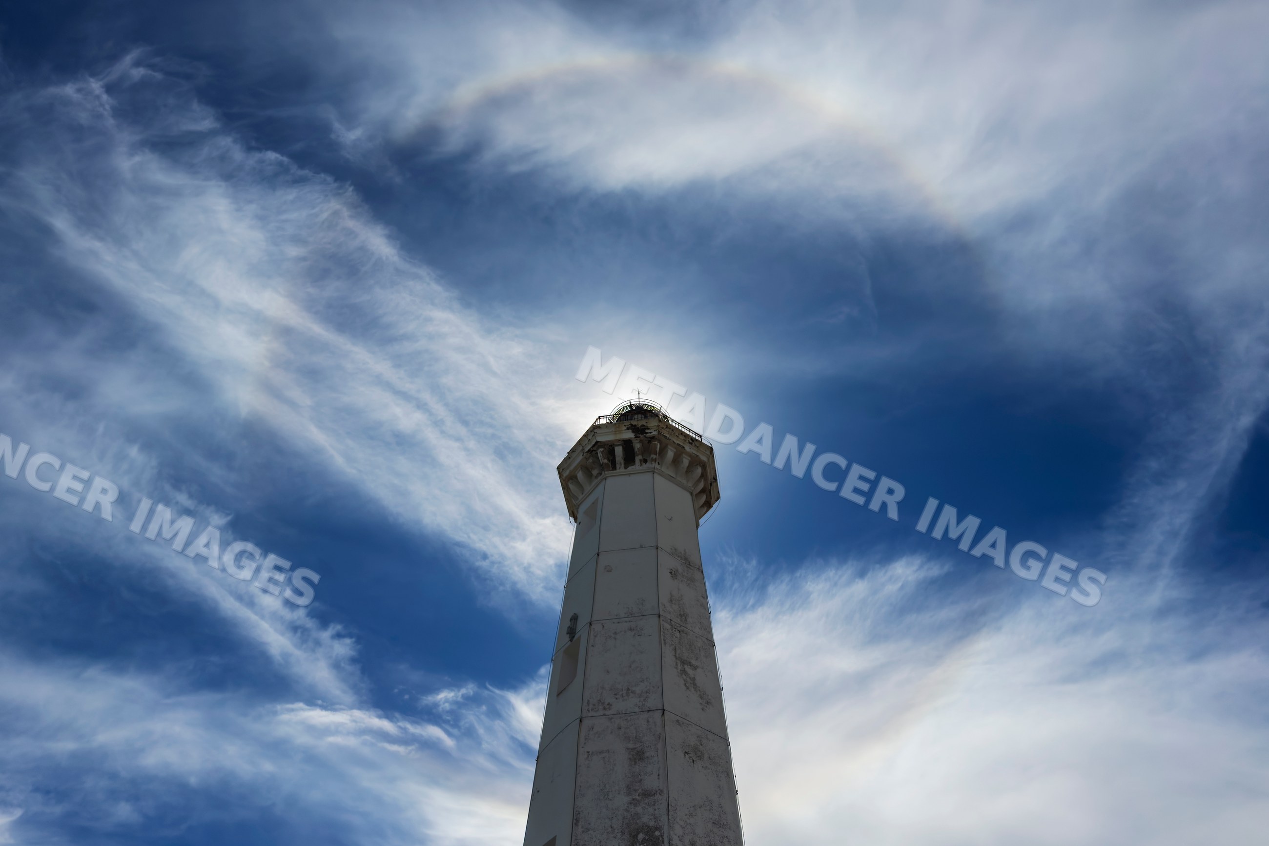 Lighthouse with sunbow halo in Torre Canne, Puglia, Italy