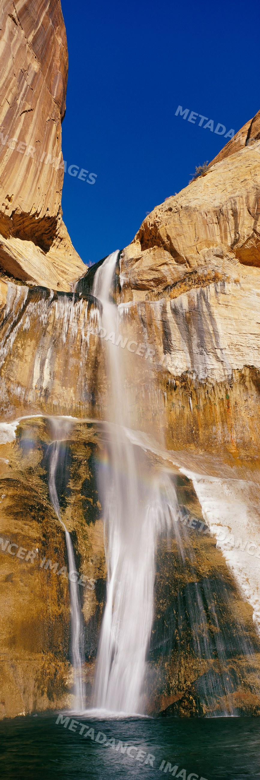 Waterfall flowing over rocky cliffs, utah