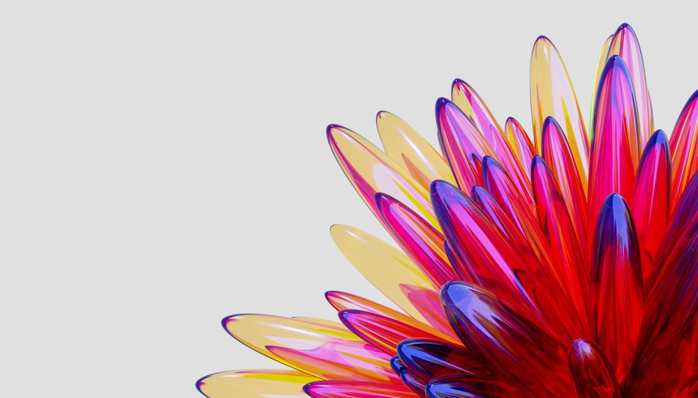 Close-up of a colorful abstract glass petal sculpture with bright