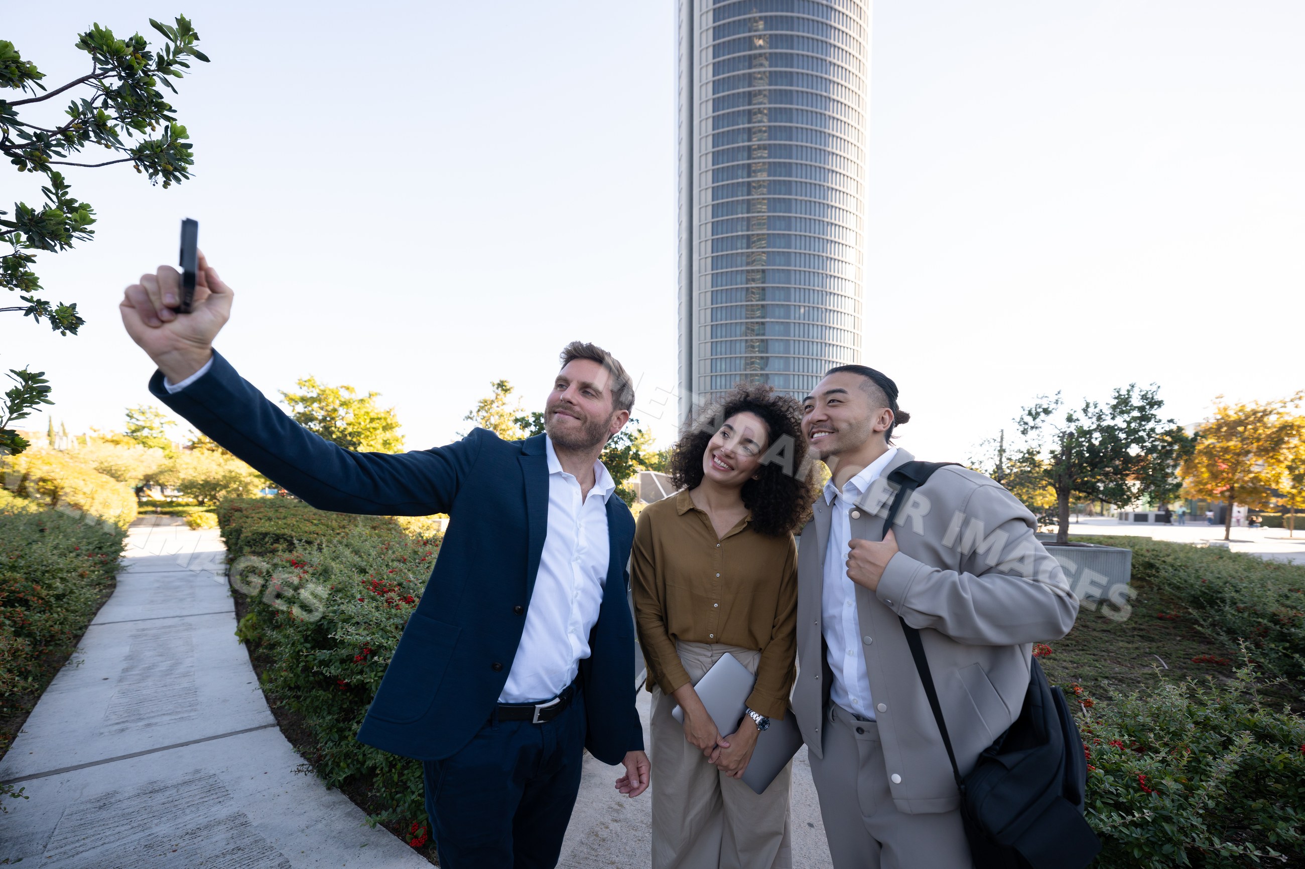 Business white professionals taking selfie outdoors