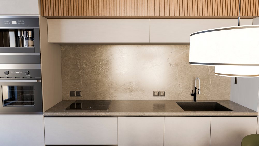 Modern kitchen interior with built-in oven and countertop stove