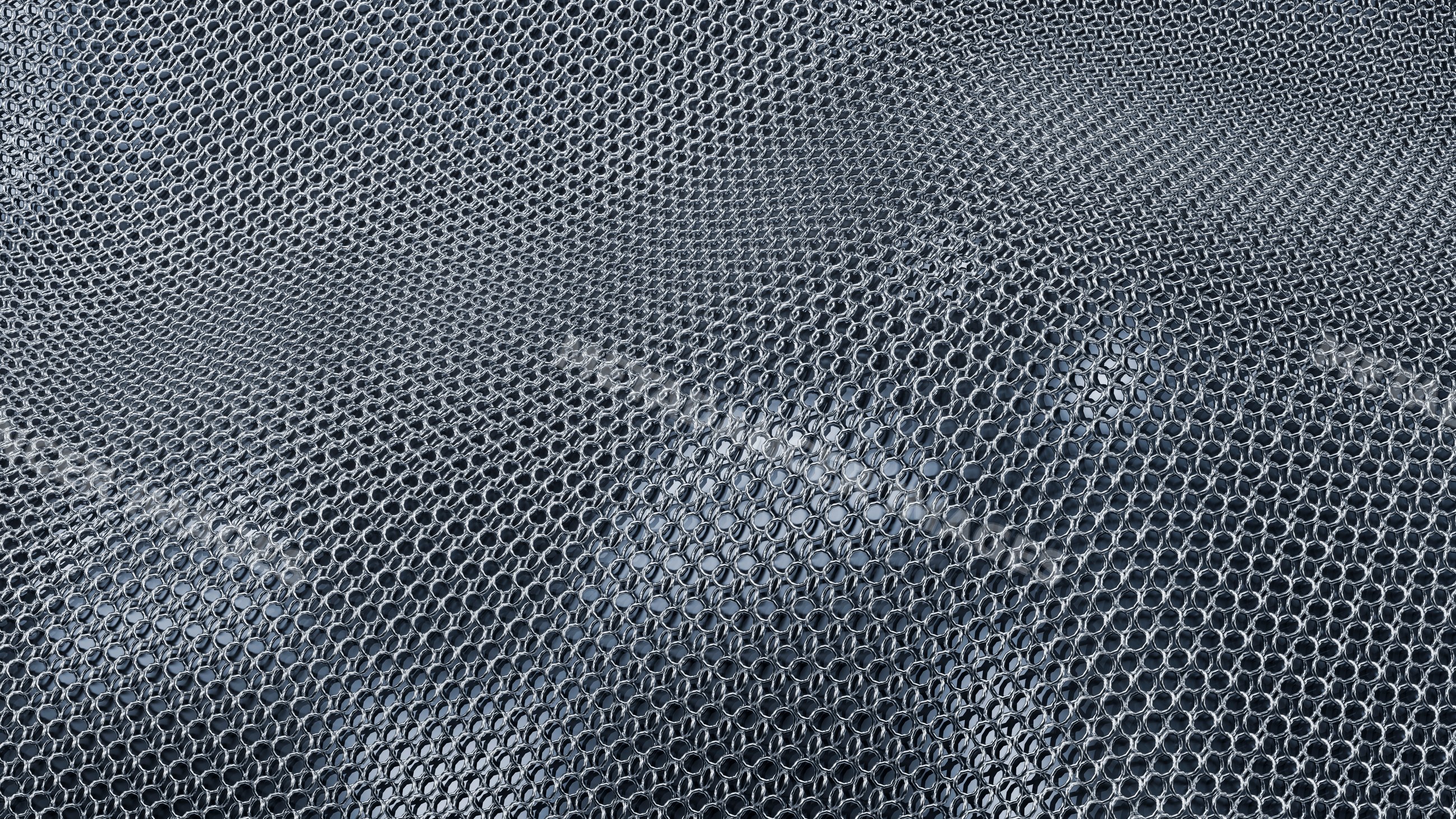 Interlinked metal rings forming historic chainmail armor pattern