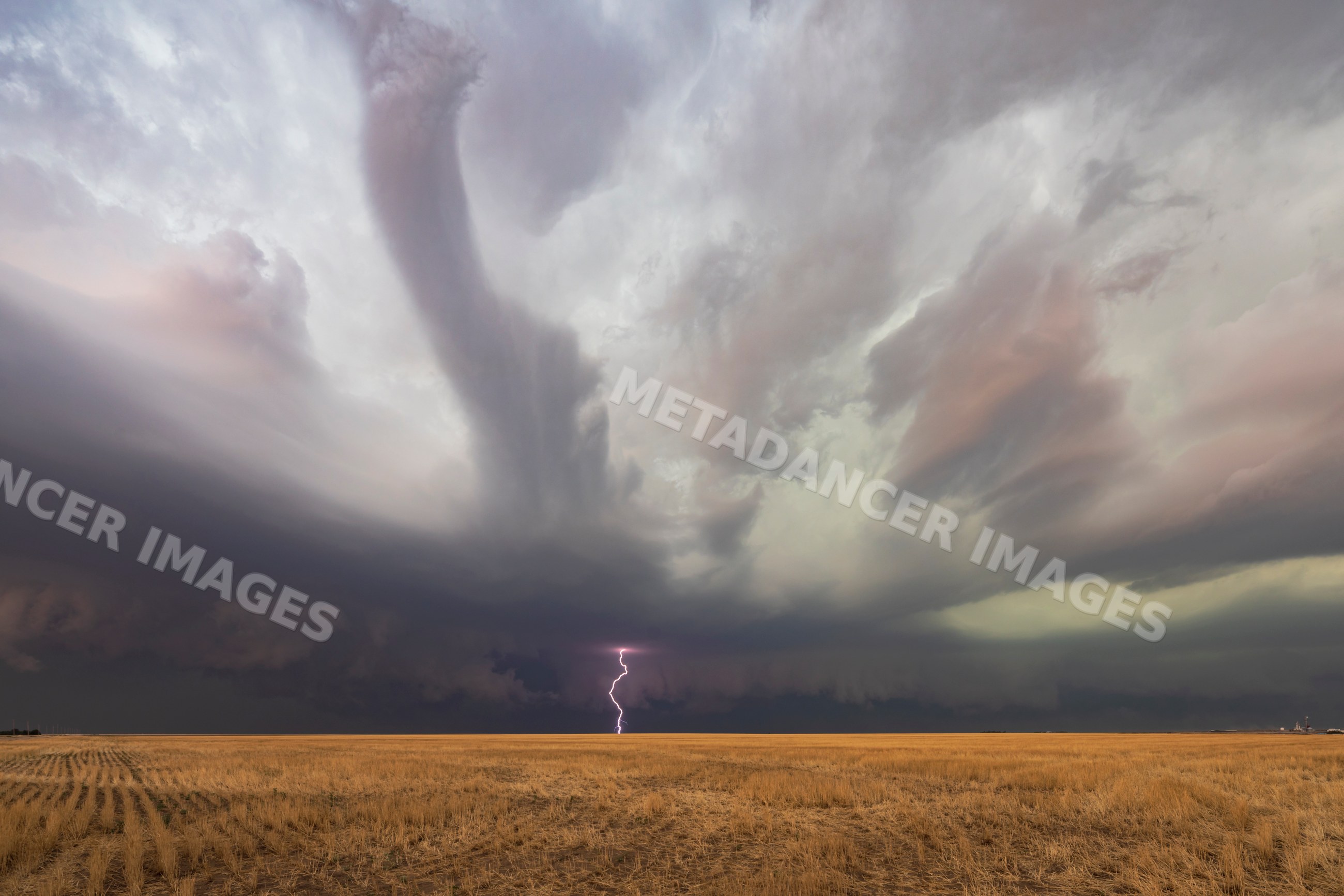 Supercell thunderstorm with lightning and tornado over kansas plains