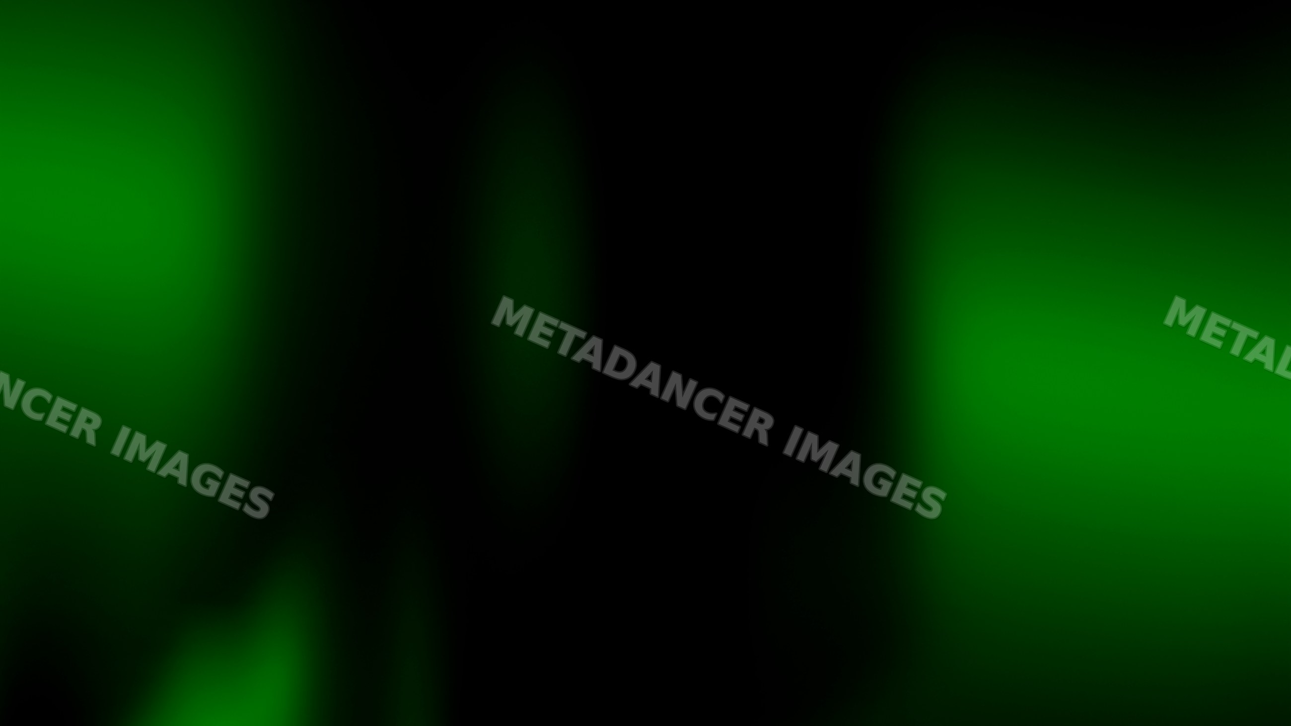 Green glowing bokeh lights on dark background