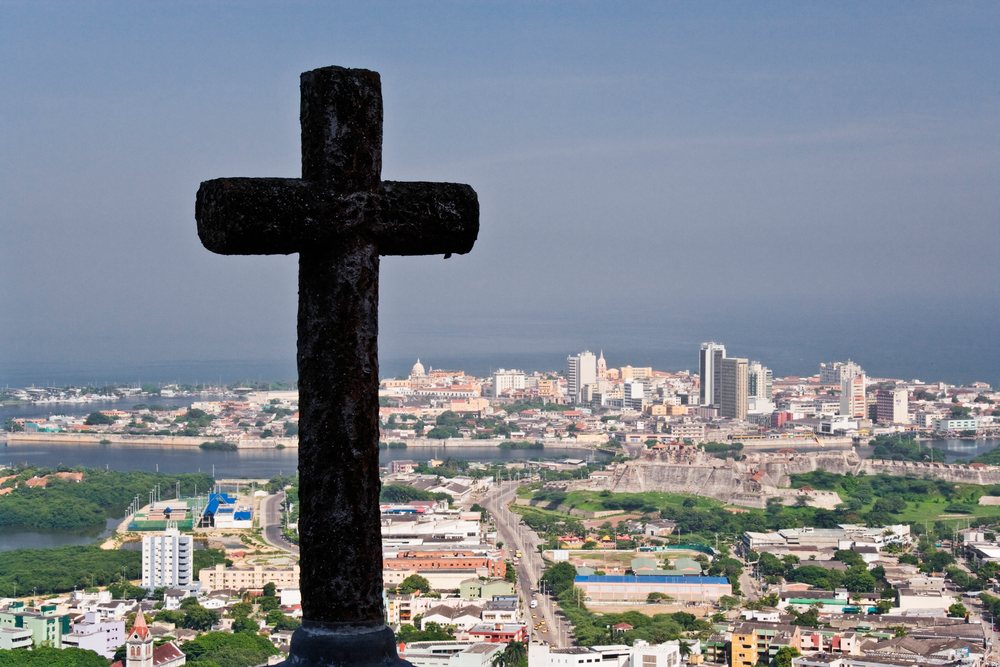 Cross overlooking cityscape and fortress in cartagena colombia