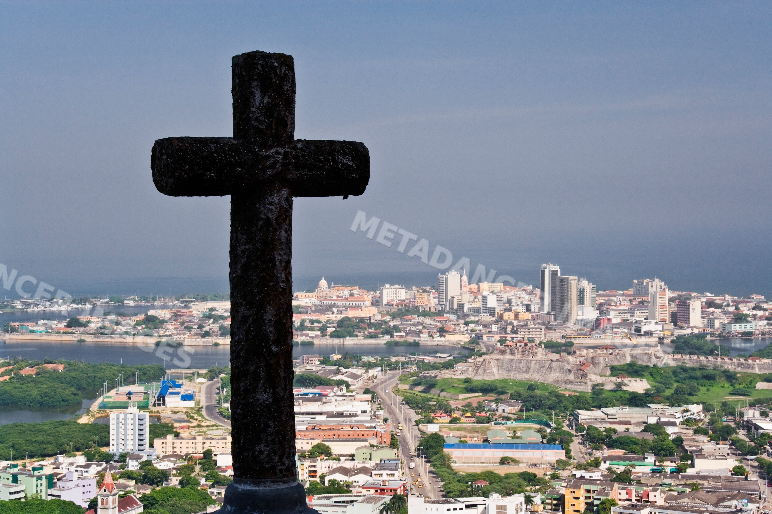 Cross overlooking cityscape and fortress in cartagena colombia