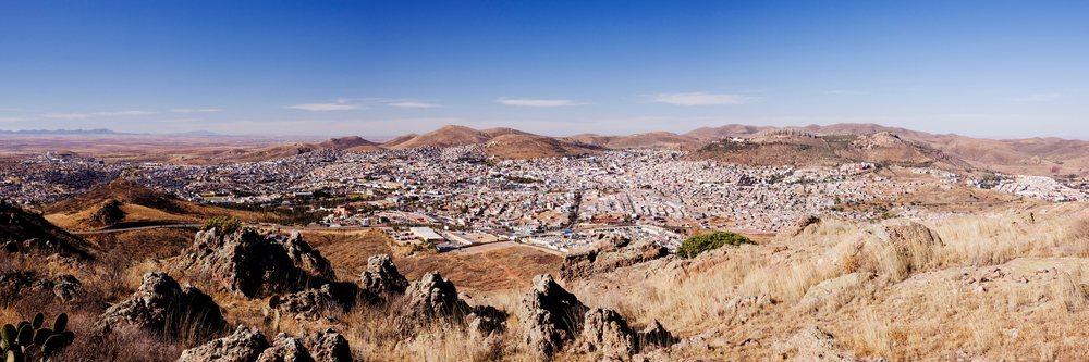 Panoramic cityscape of zacatecas with dry hills and rocky terrain