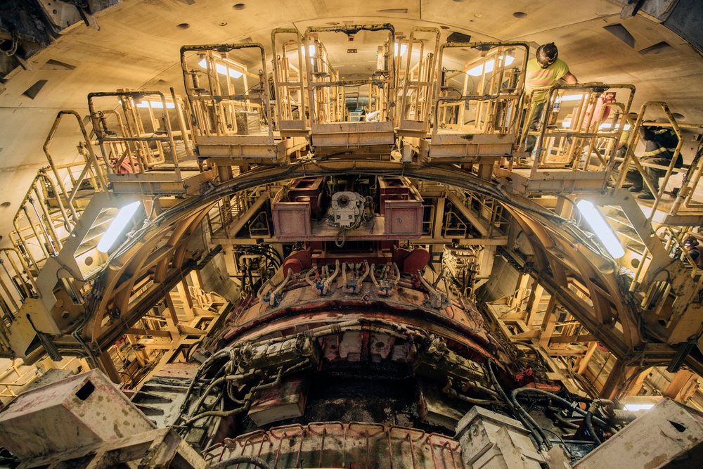 Worker inspects a tunnel boring machine