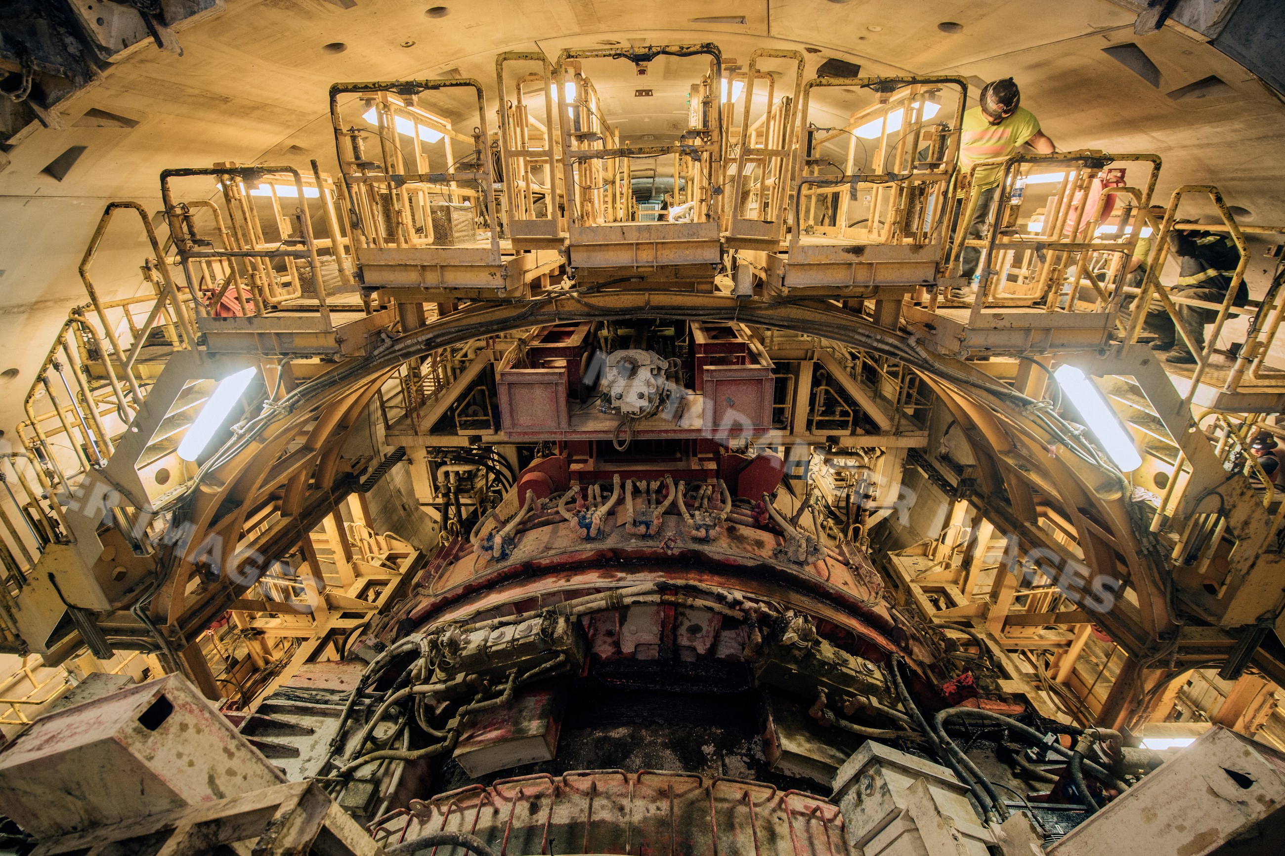Worker inspects a tunnel boring machine