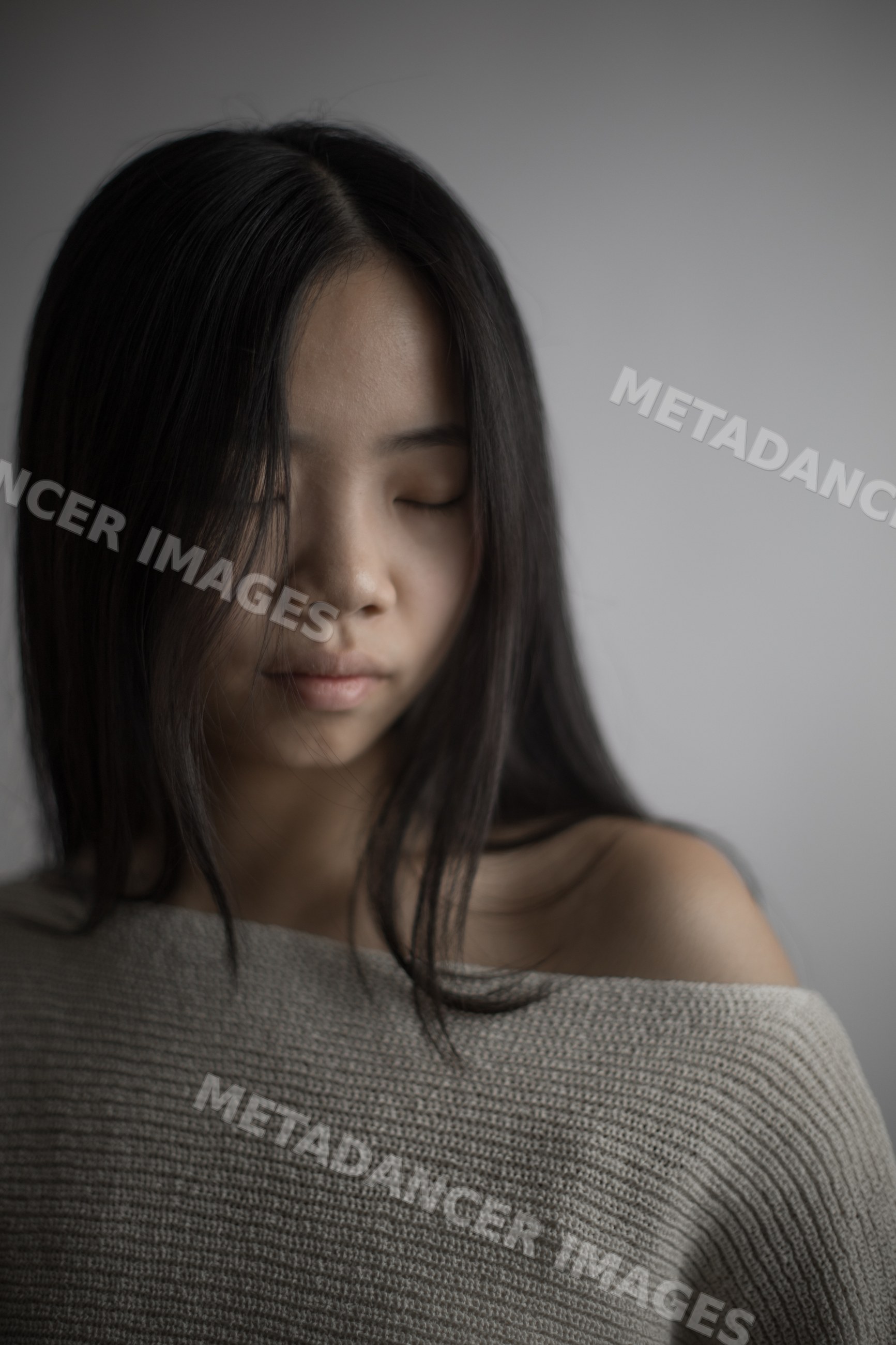 Portrait of an asian Southeast Asian woman with closed eyes