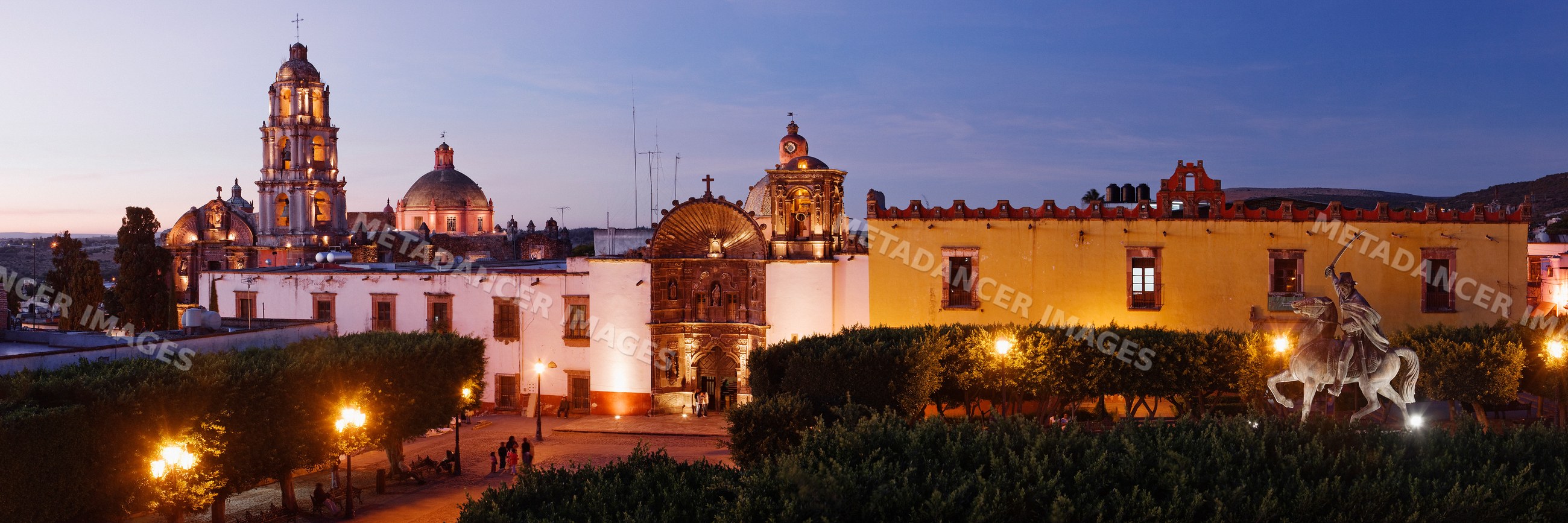 Plaza de la republica with church and equestrian statue at twilight