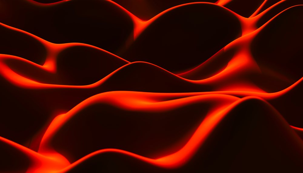 Red silk fabric with smooth flowing folds and curved waves