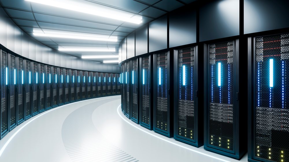 Server racks with glowing lights in modern data center corridor