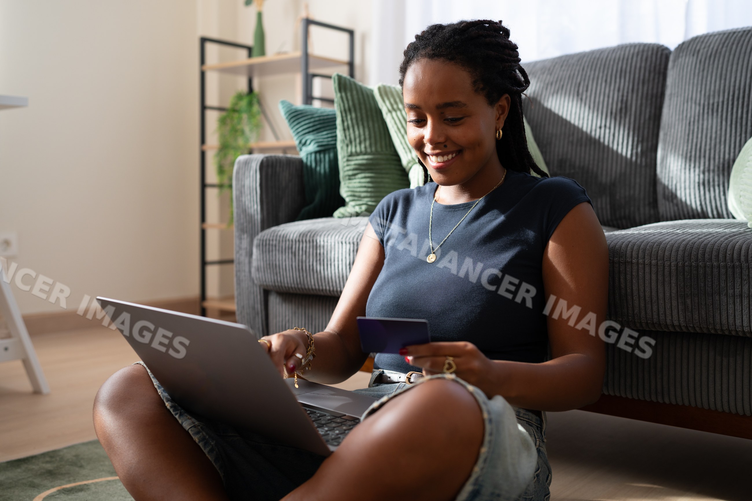 African American woman sits on the floor