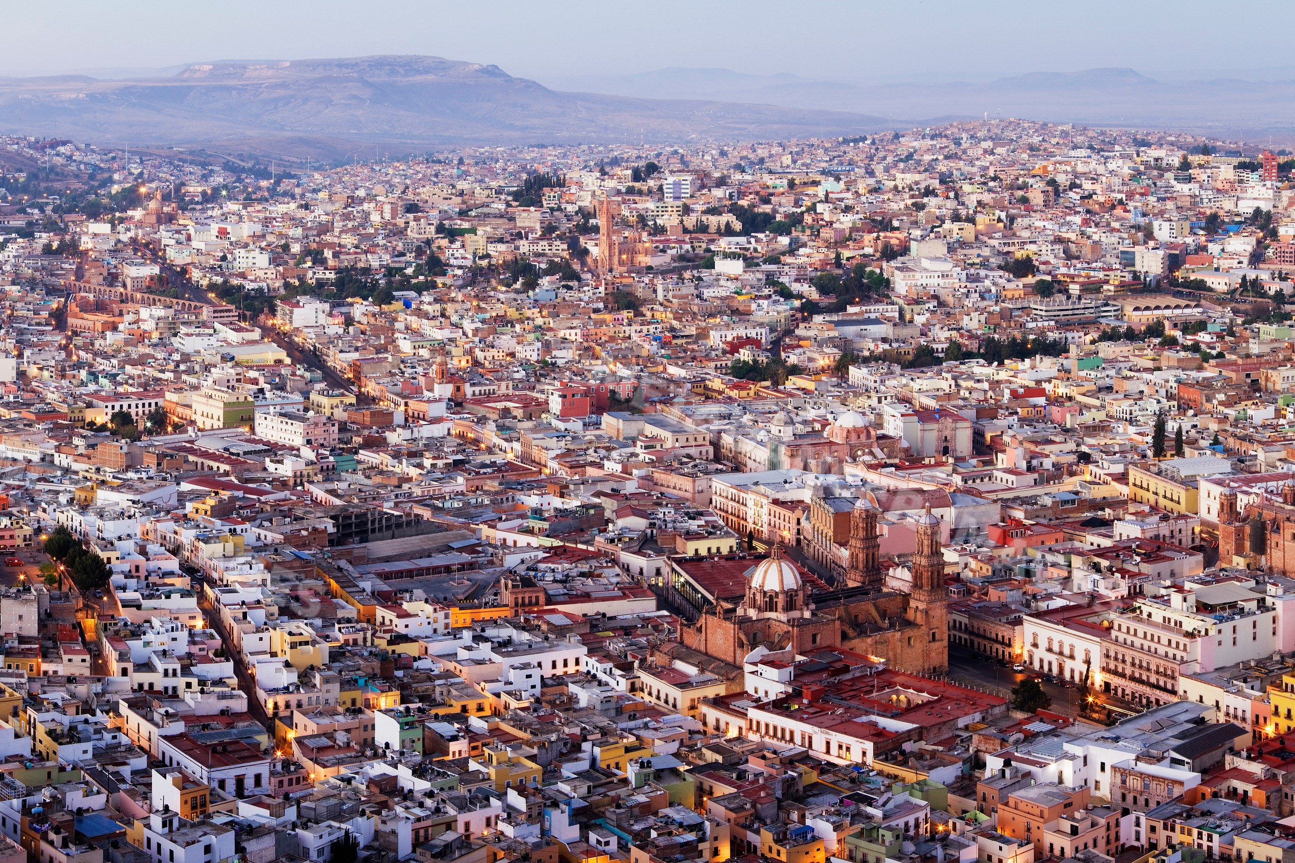 Zacatecas city overlook with architecture and mountains at dusk