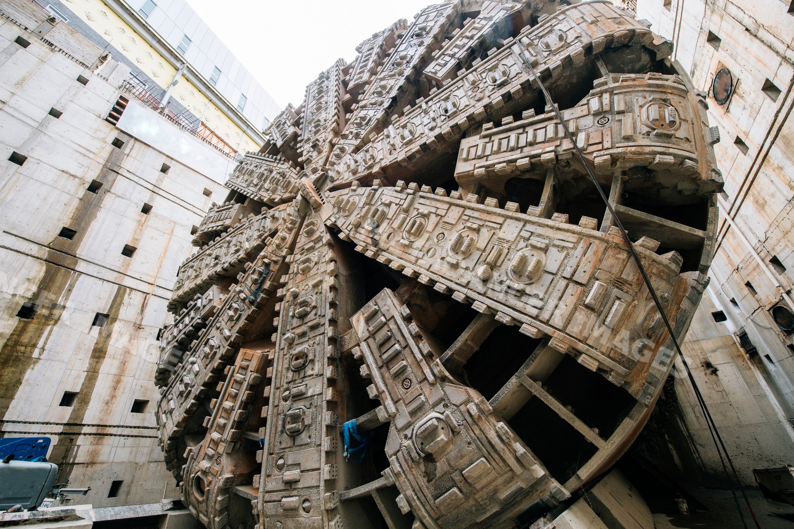 Tunnel boring machine head working in a deep construction shaft