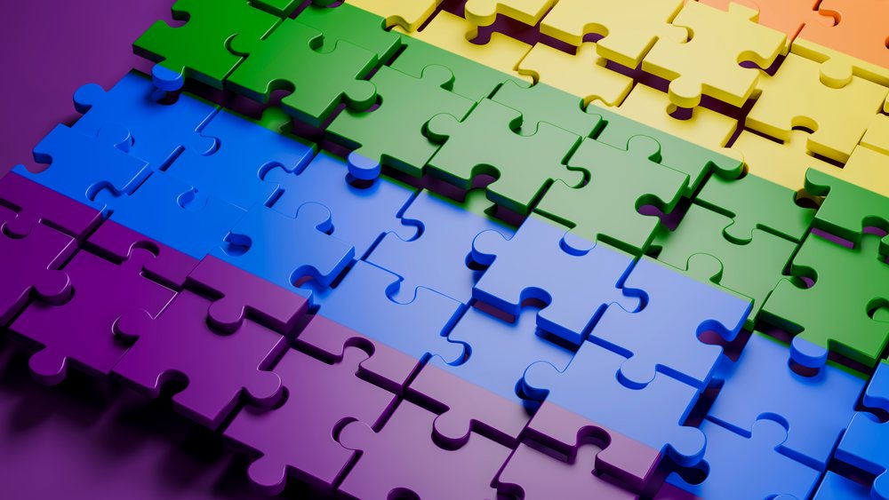 Colorful interlocking jigsaw puzzle pieces arranged in horizontal rows