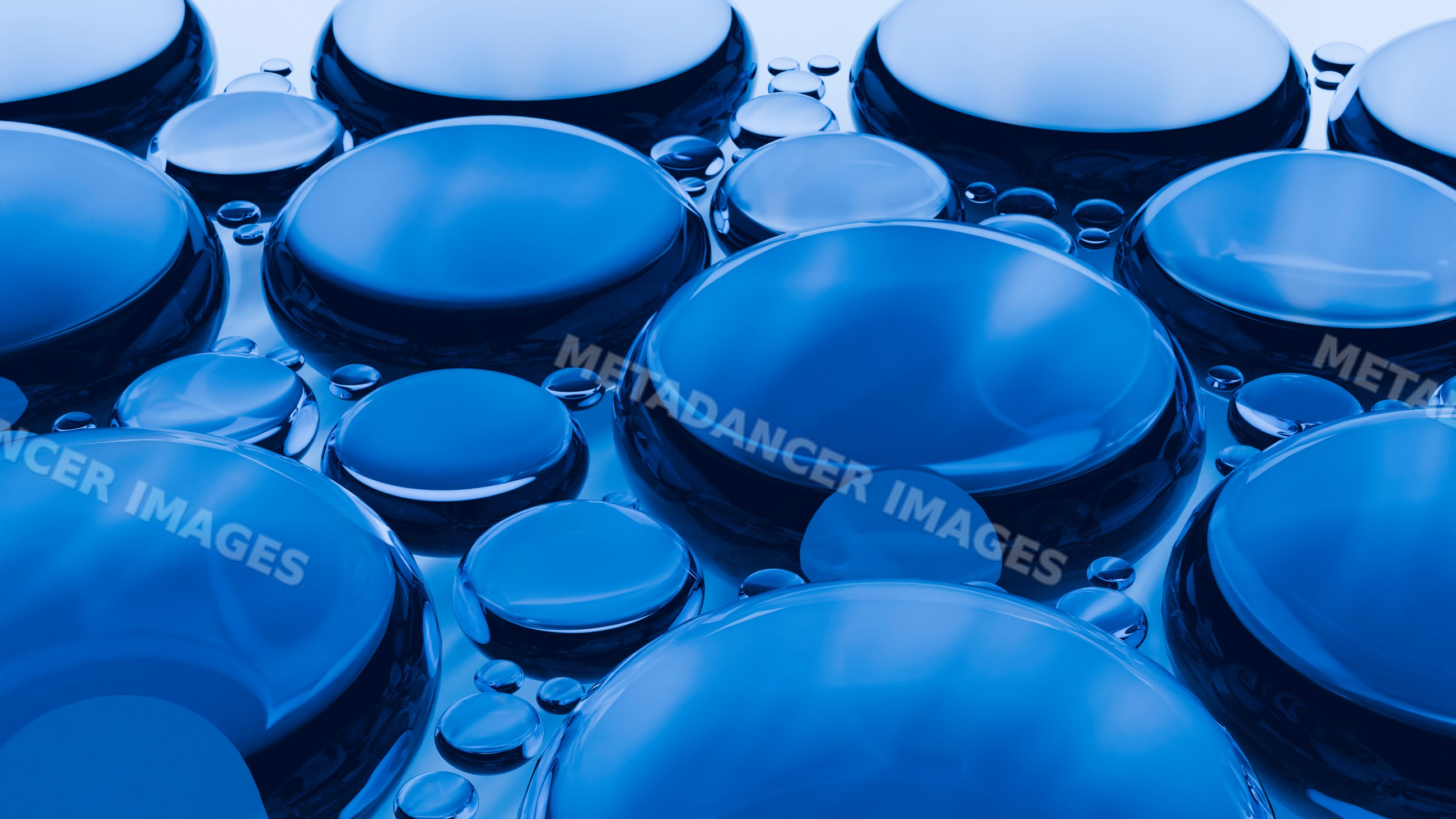 Close-up of blue liquid droplets clustered on reflective surface