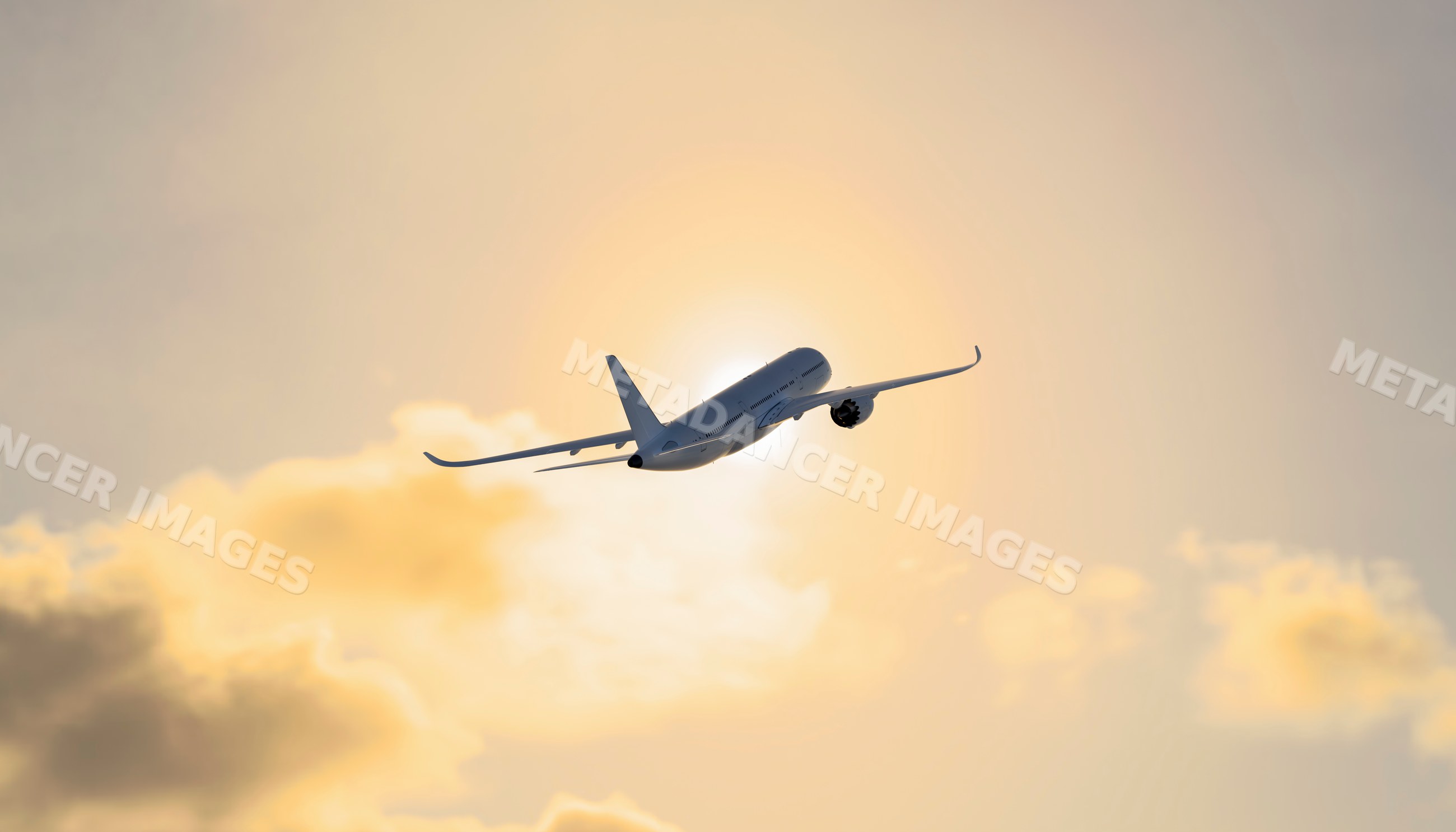 An airplane flying into the sun through clouds at sunset