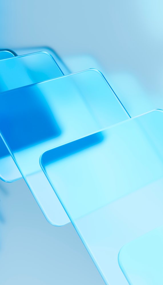 Stacked transparent blue glass panels with smooth reflective surfaces