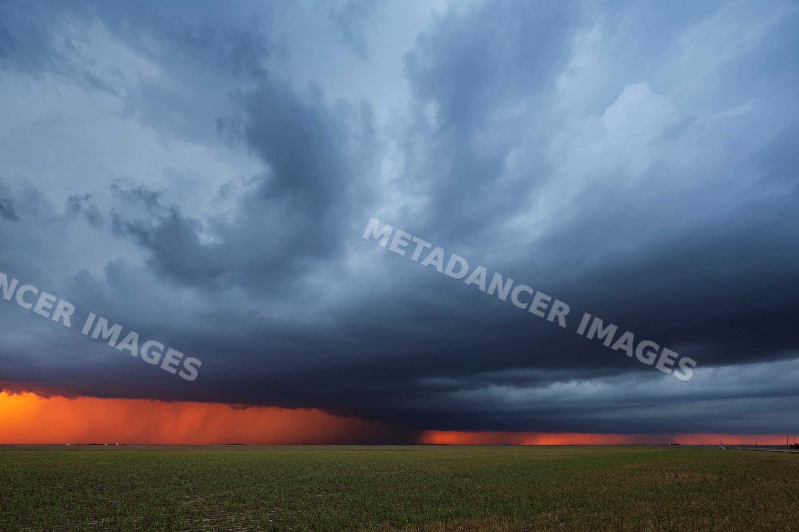 Supercell thunderstorm at Sunset over farmland in burlington colorado