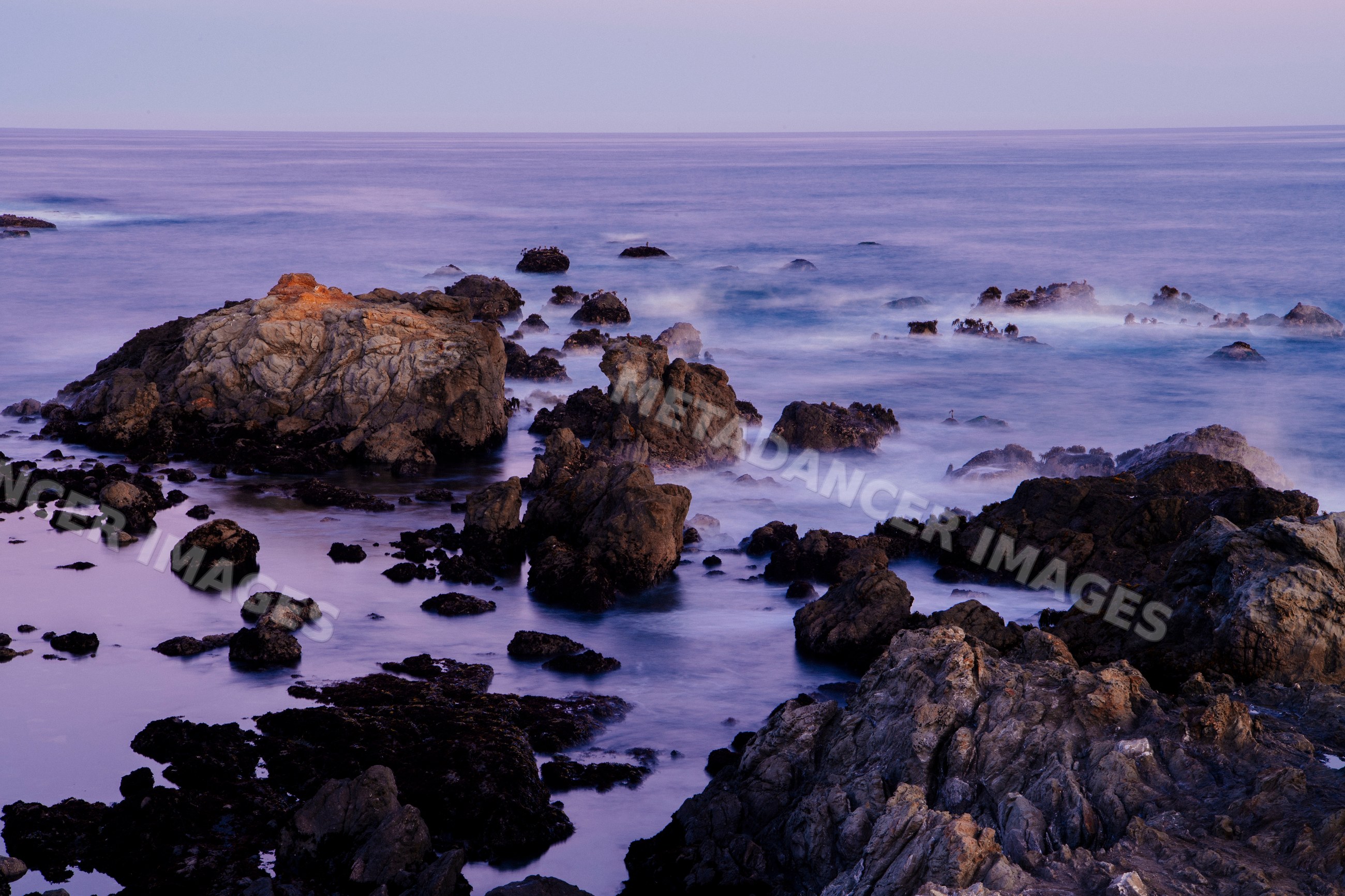 Rocky coastline with waves and jagged rocks on northern pacific coast