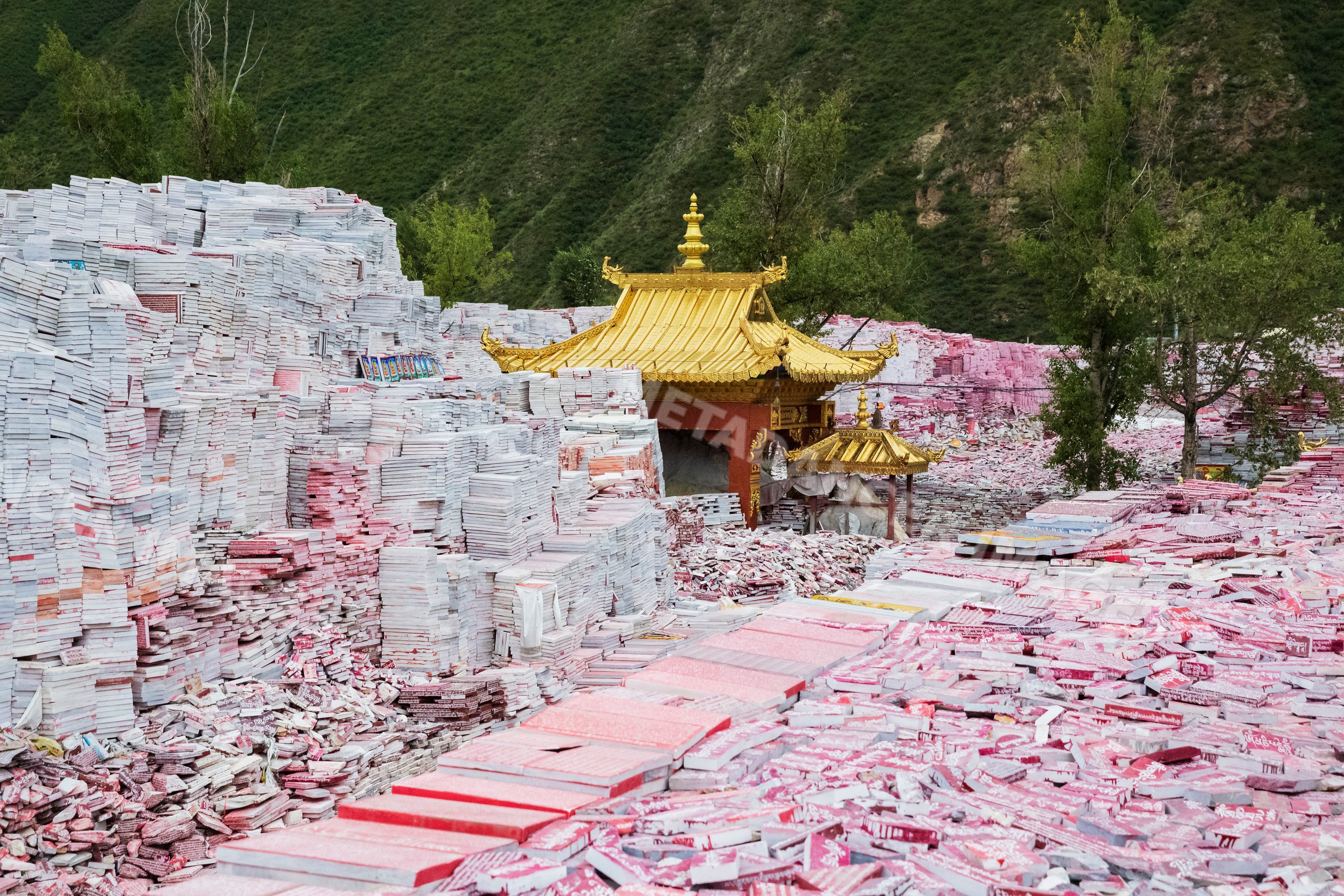 Mani Wall with golden roof temple structures in xinzhai