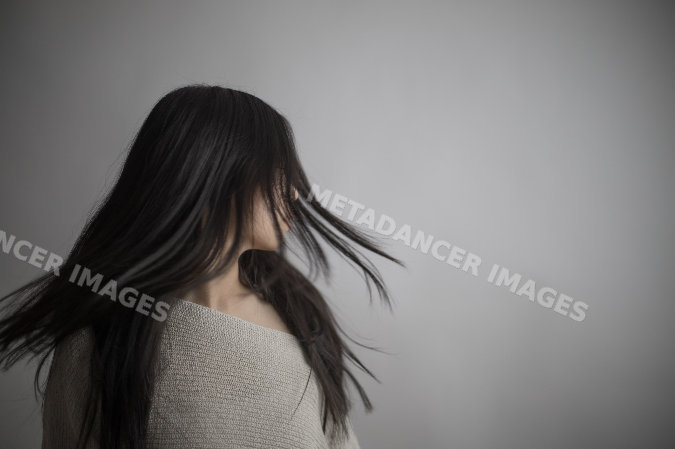 Portrait of young asian Southeast Asian woman turning with flowing