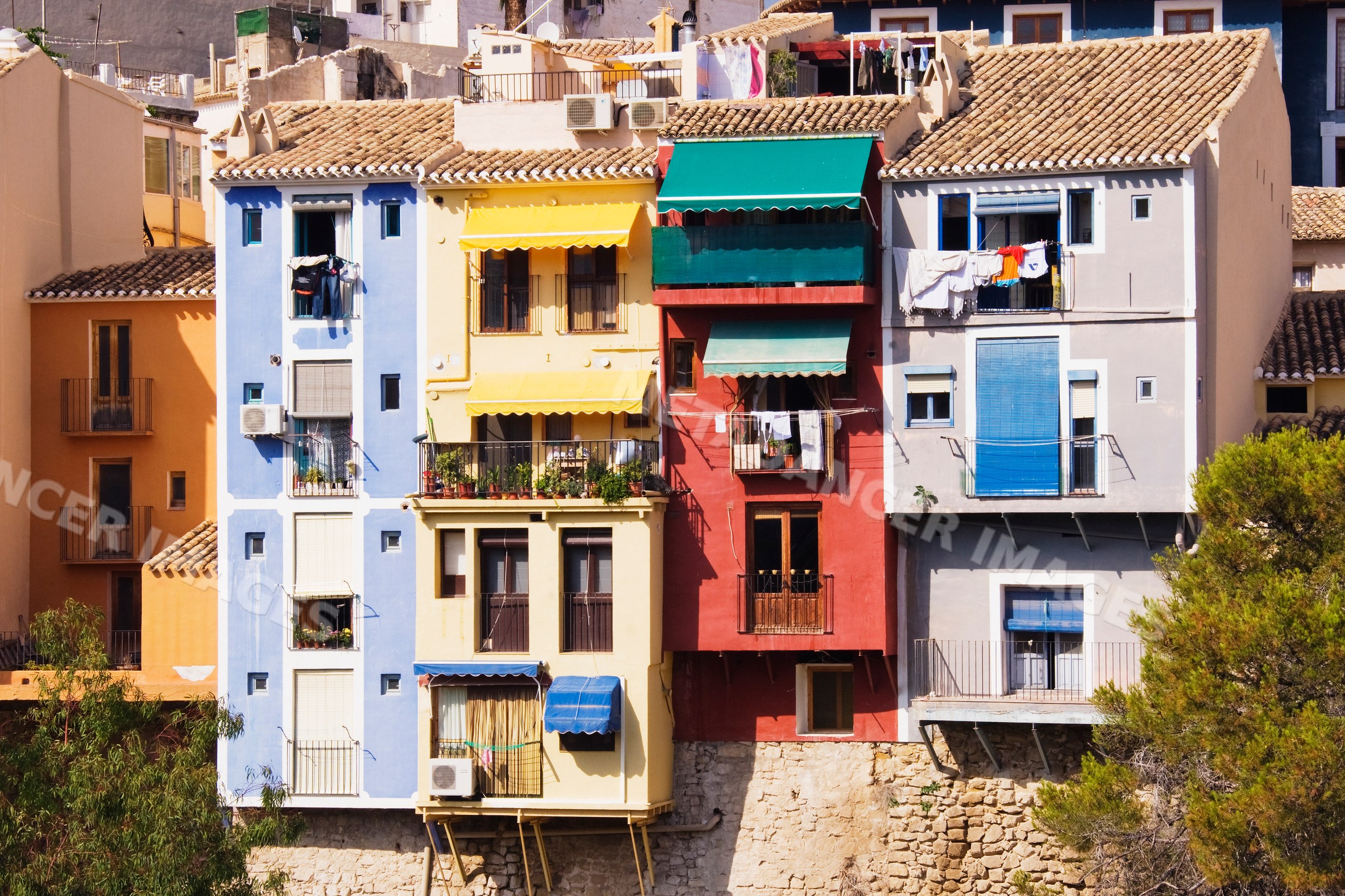 Colorful exterior of residential houses with balconies Spain