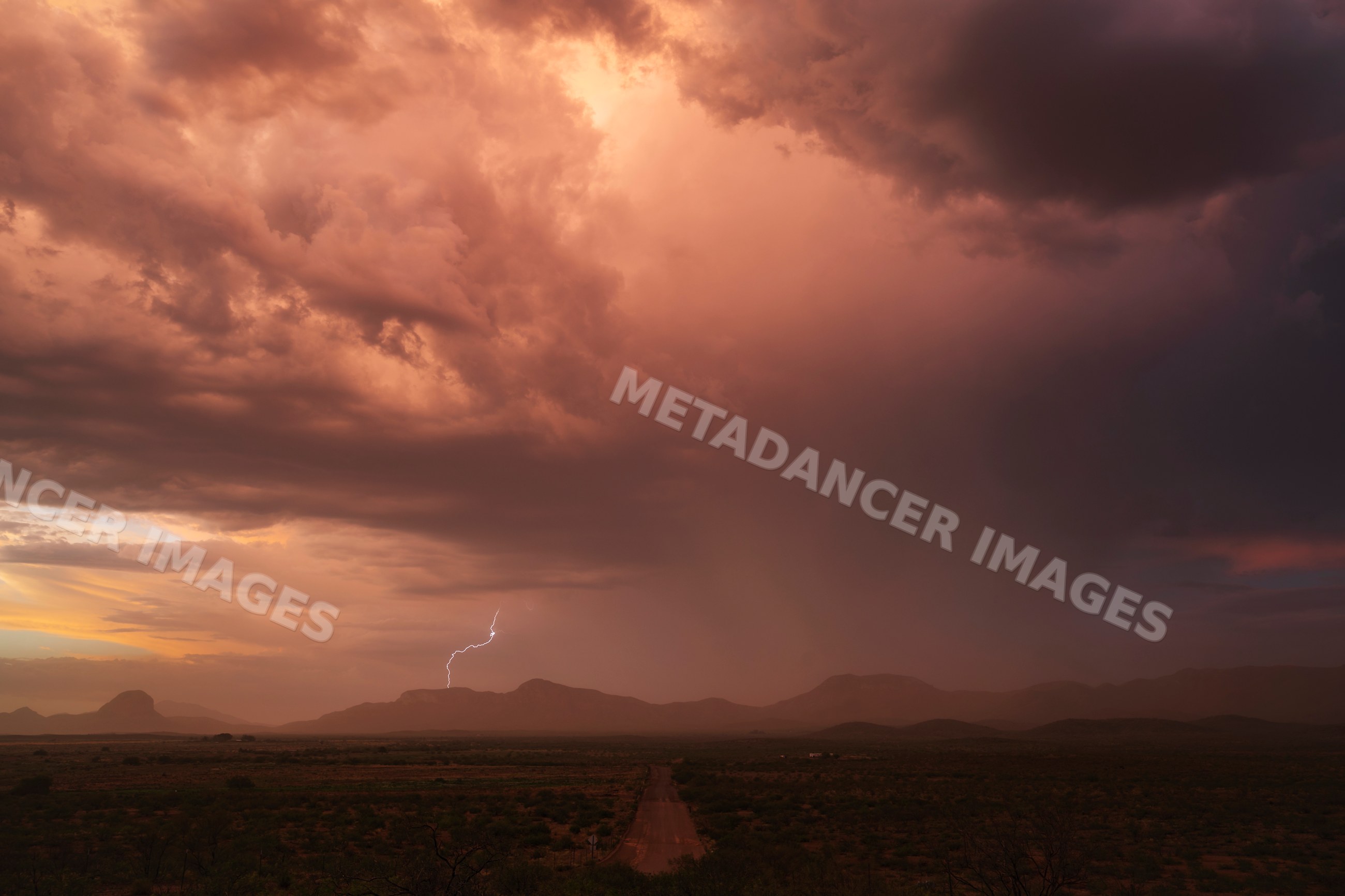 Storm laden with dust and lightning over mountains near douglas
