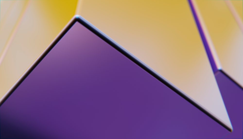 Close-up of abstract purple and yellow geometric glass shapes