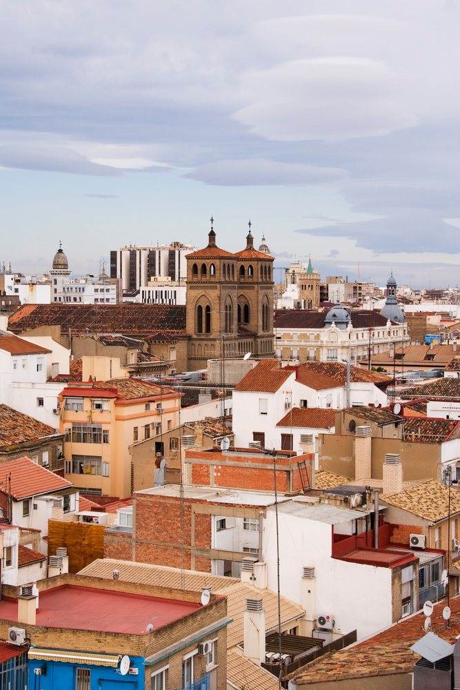 Cityscape of zaragoza with historic church tower and urban rooftops