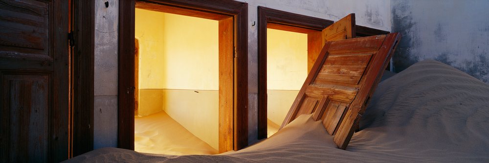 Sand filling rooms in an abandoned building namibia