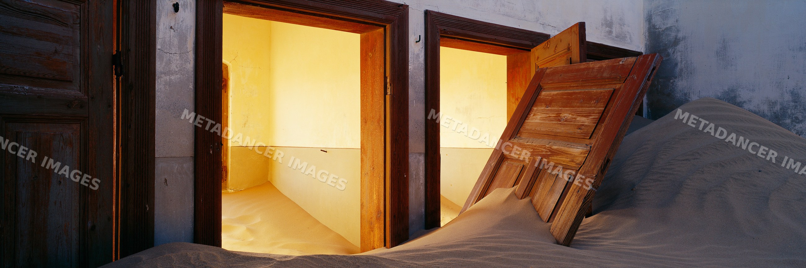 Sand filling rooms in an abandoned building namibia