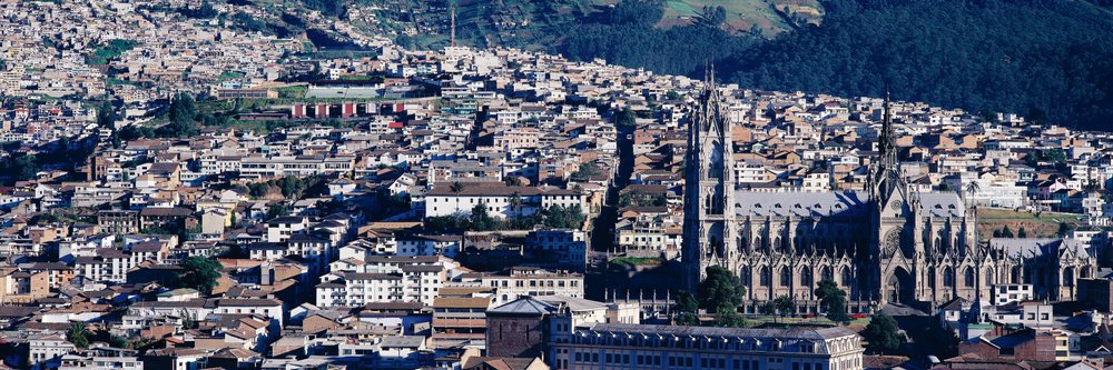 Historical cityscape of quito with prominent church and urban