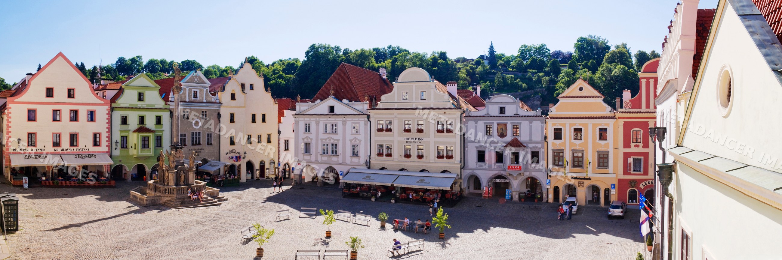 Historic town square with fountain and outdoor seating, czech republic