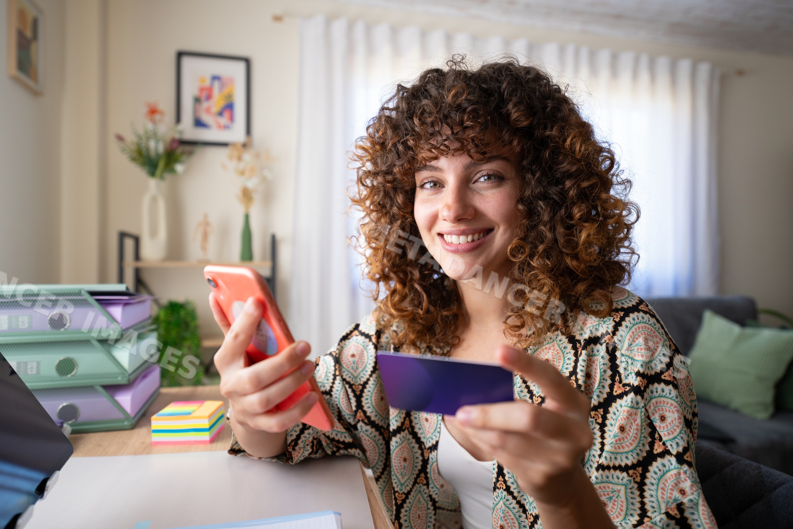 White girl using smartphone and credit card