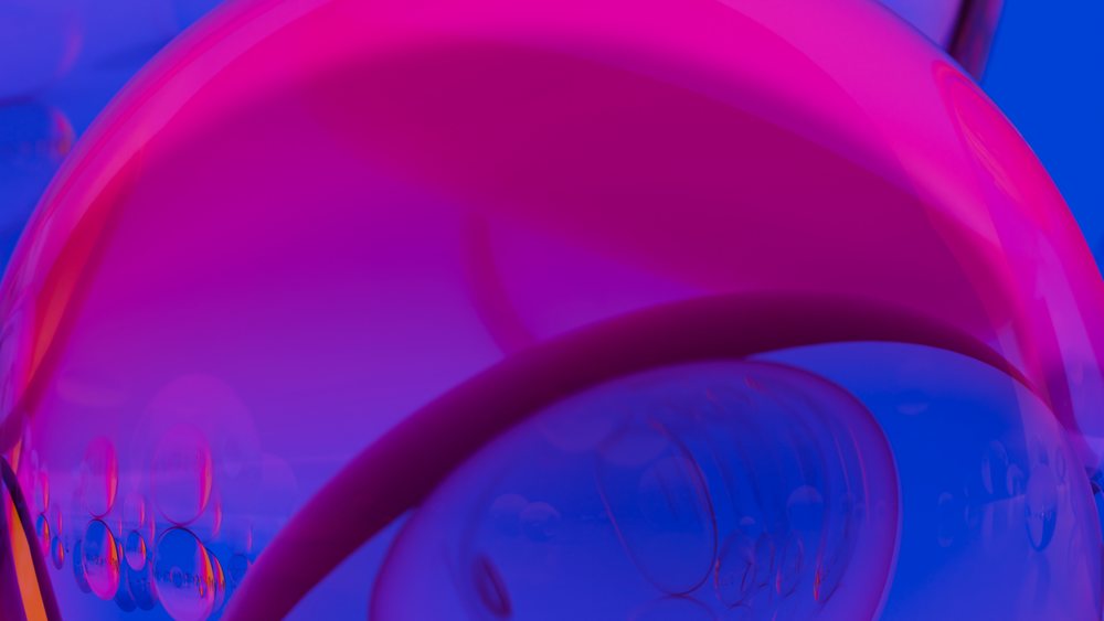 Colorful abstract closeup of bubbles with vibrant blue and pink hues