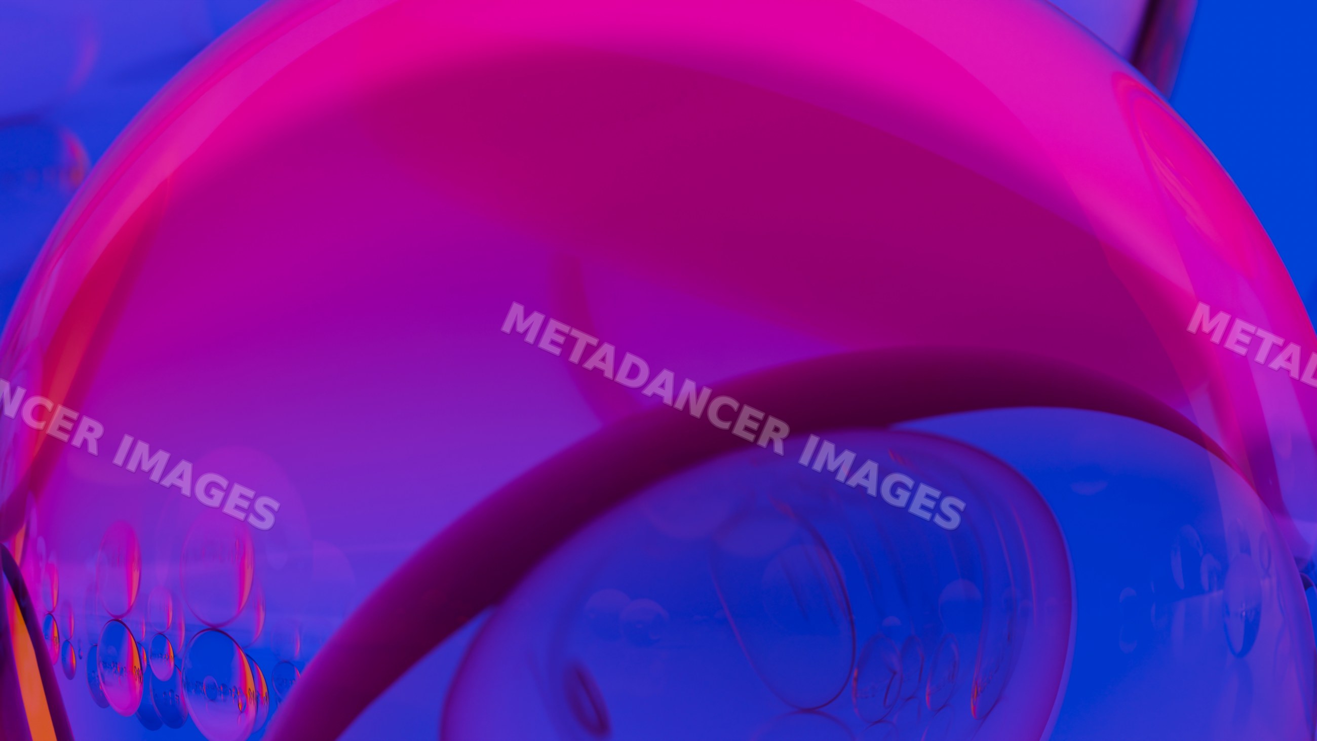 Colorful abstract closeup of bubbles with vibrant blue and pink hues