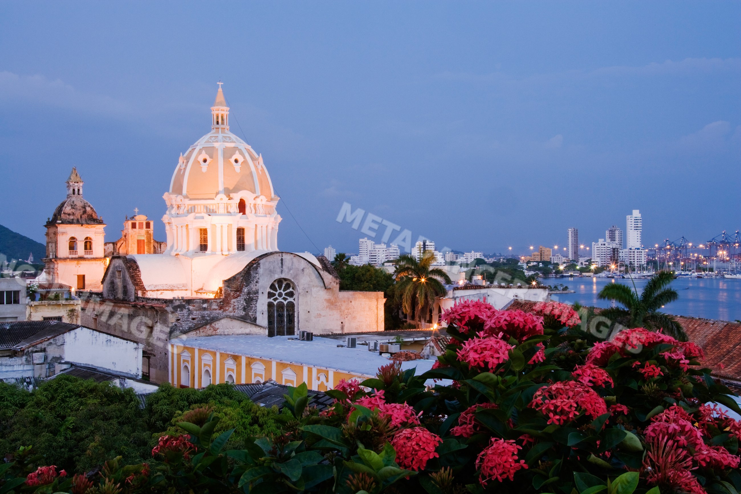 Iglesia de san pedro claver illuminated at dusk, colombia