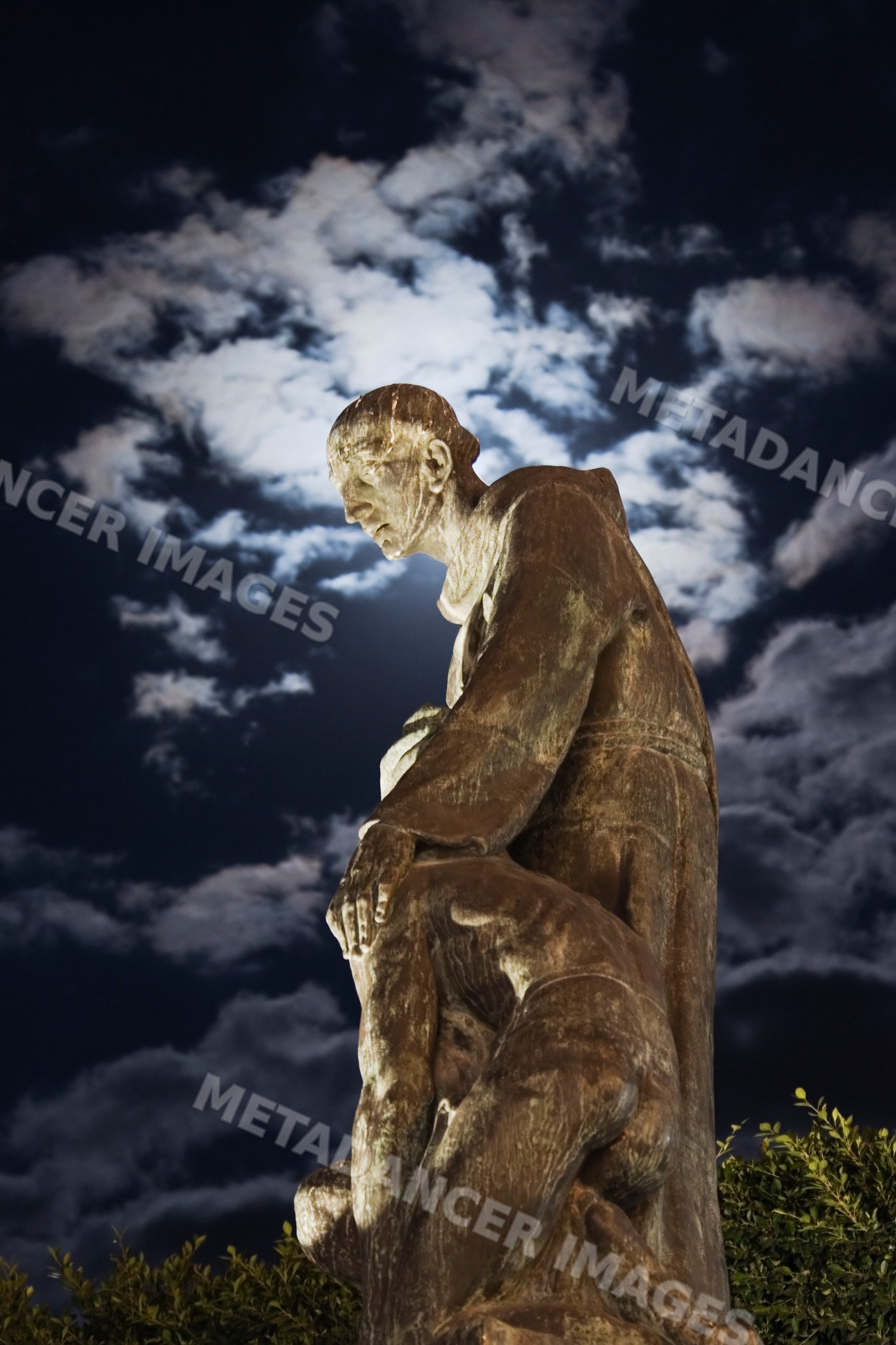 Bronze statue of san miguel at night, mexico