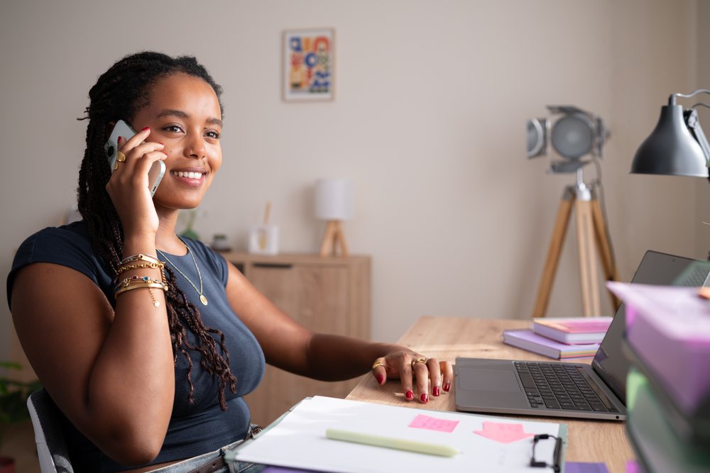 African American woman talks on the phone