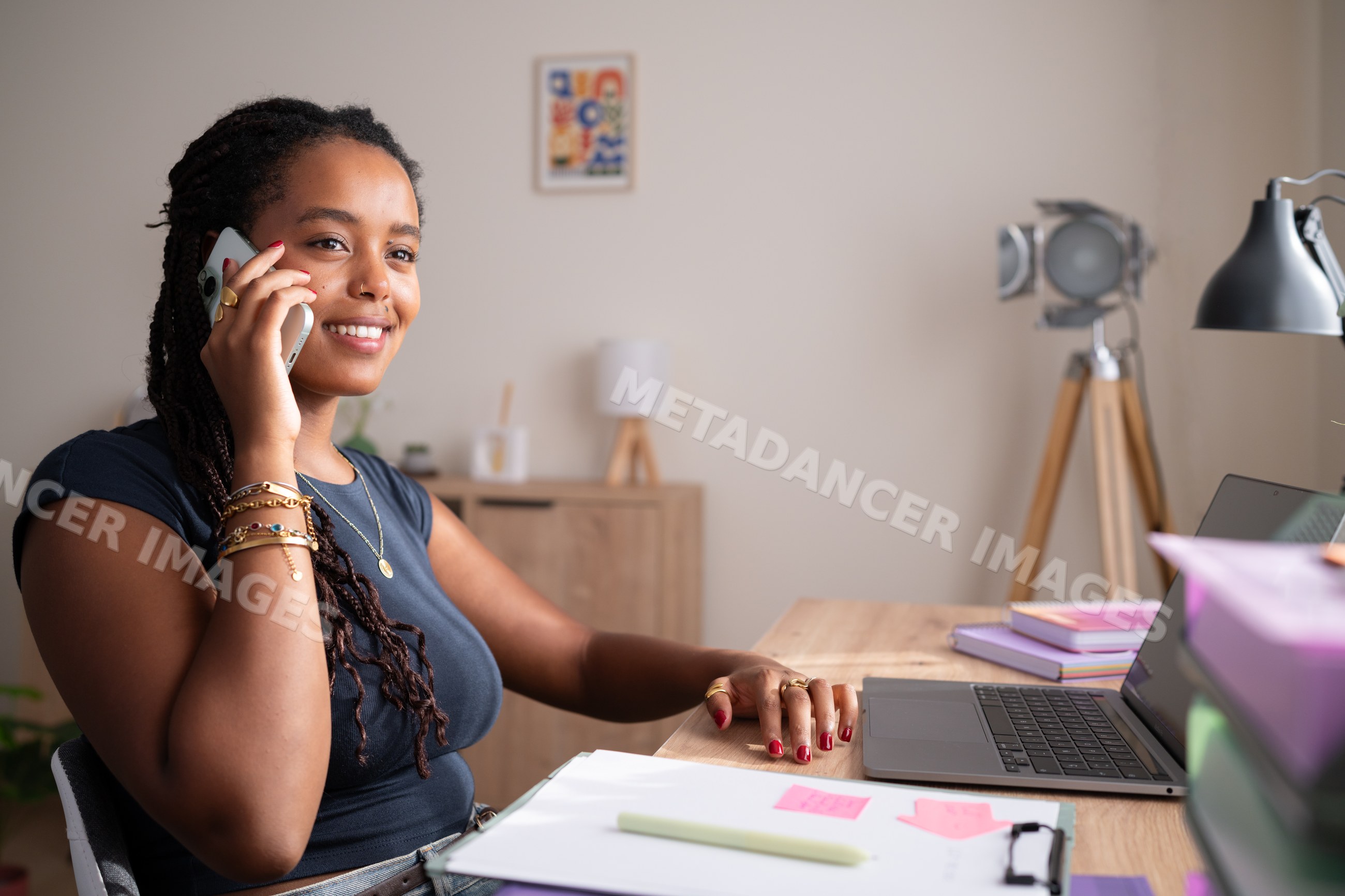 African American woman talks on the phone